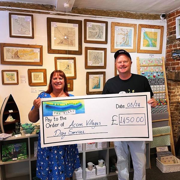 Day Services Manager Phil Wilden accepts cheque.jpg